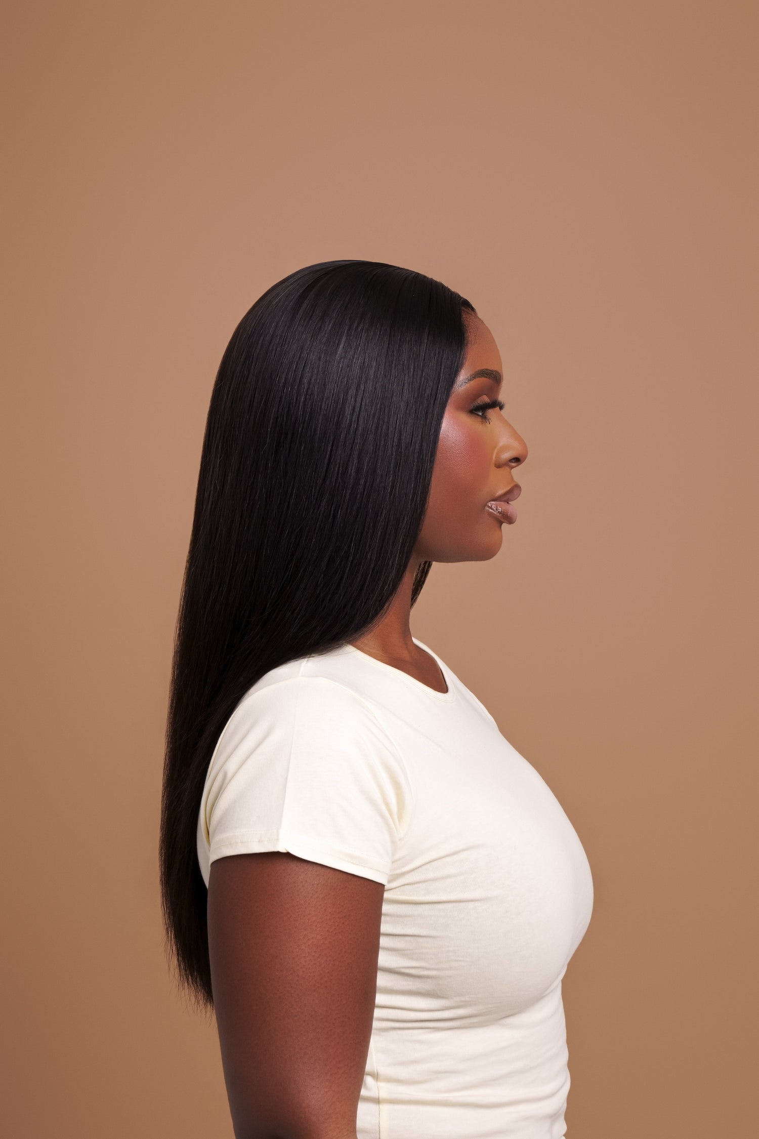Black woman wearing virgin hair bundles and lace system